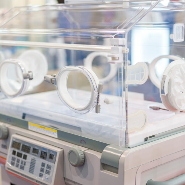 A stock photograph of an empty incubator in a hospital neonatal intensive care unity / NICU