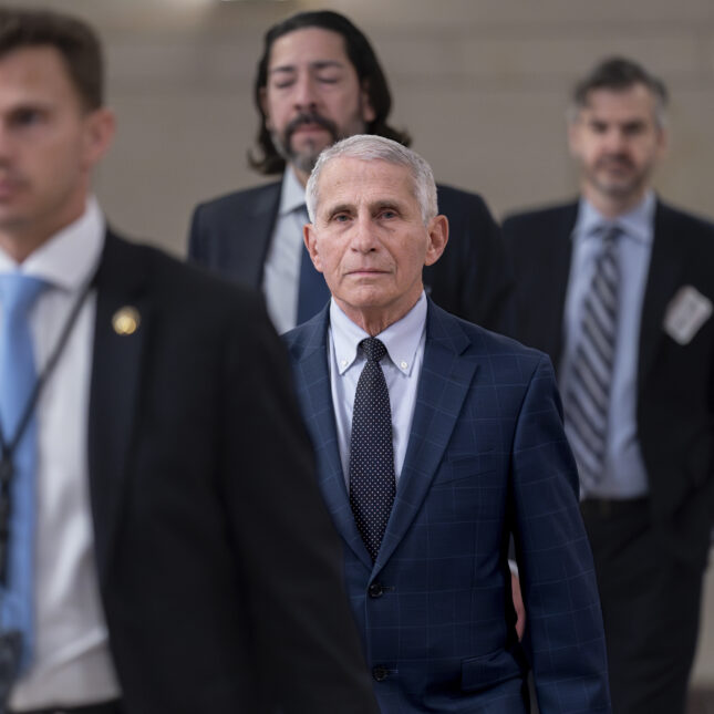 Anthony Fauci, center, who served as the nation's top infectious disease expert before retiring last year, arrives on Capitol Hill. -- health policy coverage from STAT