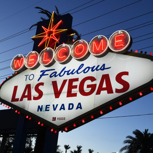 Red lights flicker around the Welcome to Fabulous Las Vegas sign. -- health coverage from STAT