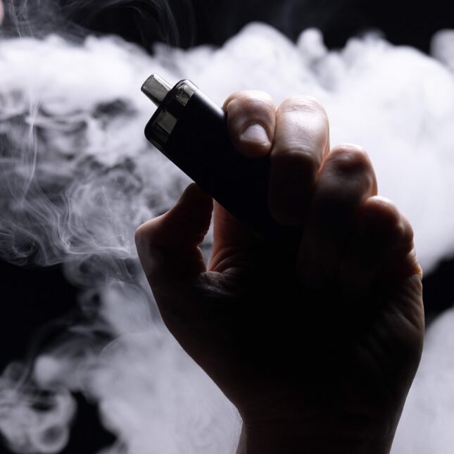 show an individual vaping an electronic cigarette