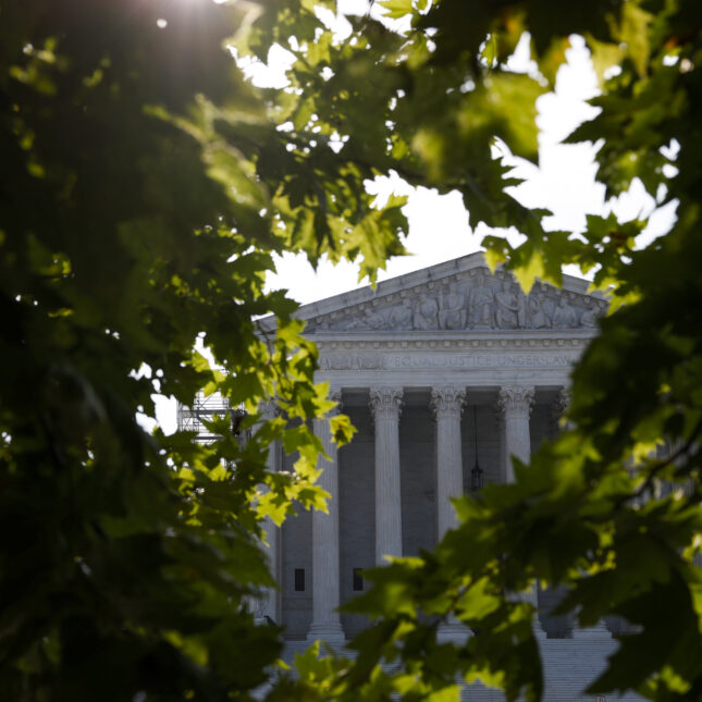 The U.S. Supreme Court building is seen through trees. -- health equity coverage from STAT