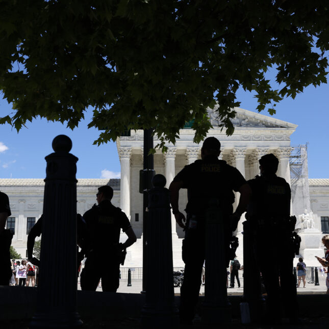 Capitol Police officers observe an abortion rights protest outside of the U.S. Supreme Court Building on June 24, 2024 in Washington, DC.