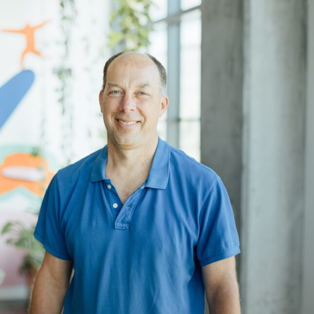 Portrait of Steve Quake wearing a blue shirt. -- biotech coverage from STAT